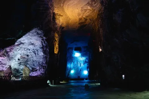 Salt Cathedral of Zipaquirá, saline rock pool highlighted with green light.