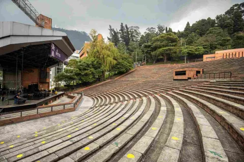 Side view of the stage and the first few rows of brick seating.