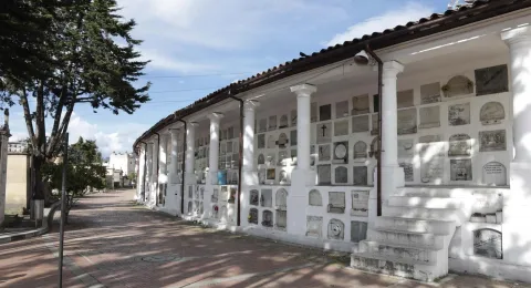 General view of white crypts containing ossuaries.