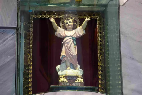Close-up of the Divine Child Jesus with outstretched arms.