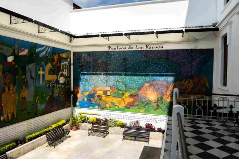 Interior room with two murals depicting the Police and the community. There's a sign that reads: "Pantheon of Heroes."