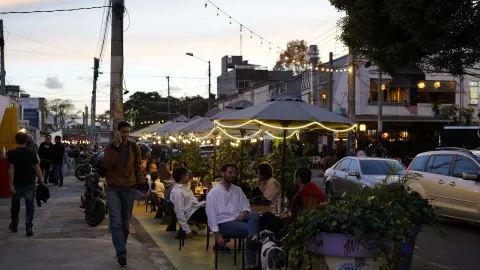 San Felipe comes alive at dusk with open-air terraces, restaurants, warm lighting, and visitors strolling along its streets.