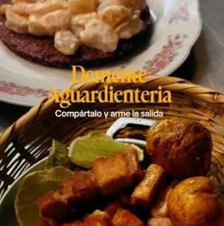  Variedad de sabores colombianos servidos para compartir, con carnes, papas, arepas y acompañamientos tradicionales.