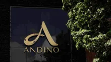 Facade featuring a large, gold letter A and the word ""Andino"" against a black background.