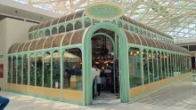 Shop characterized by its oval-shaped facade and roof.