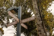 A traffic sign indicating the direction to several towns, including Facatativá, Usaquén, Sabana, and Soacha.