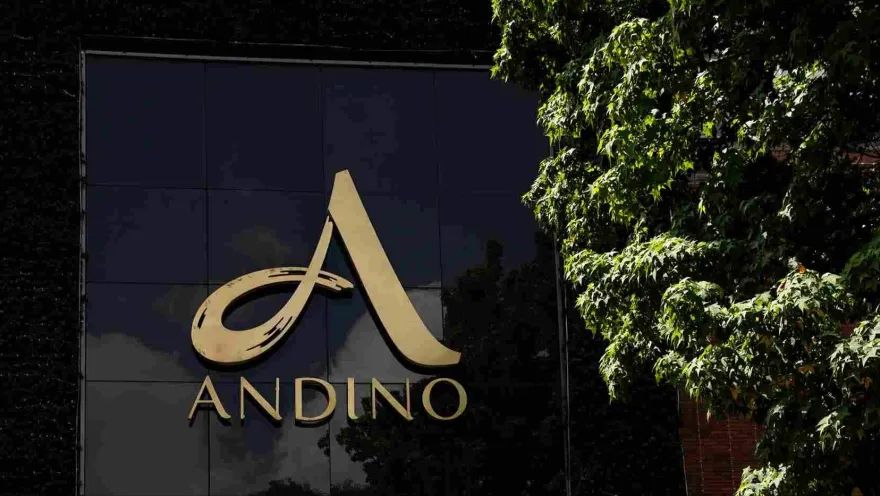 Facade featuring a large, gold letter A and the word ""Andino"" against a black background.