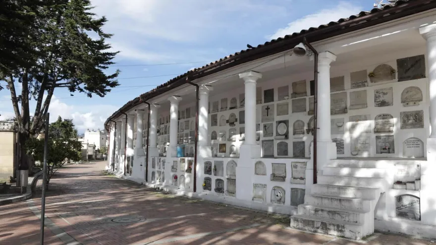 General view of white crypts containing ossuaries.