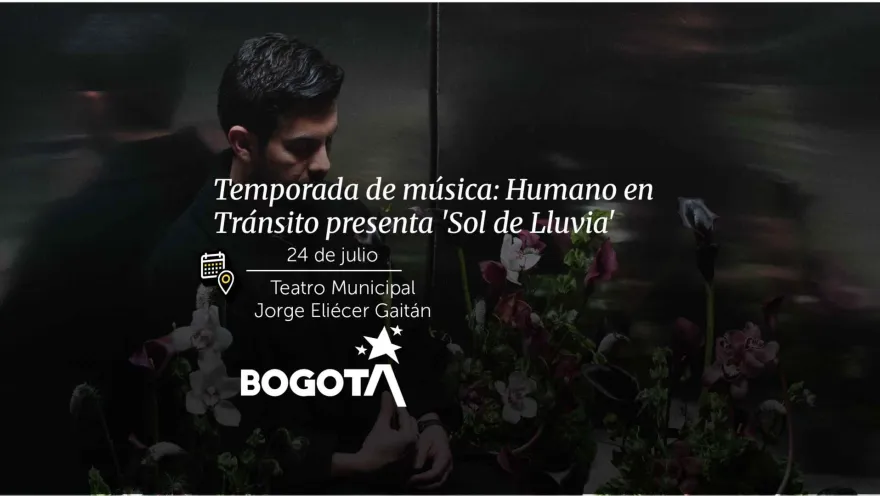 A man looking down, surrounded by purple flowers, for the event Humano en Tránsito Presents ‘Sol de Lluvia’.