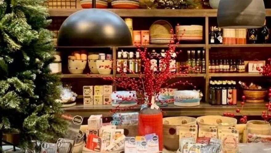 Interior of a cacao and chocolate product shop, featuring decorated shelves and artisanal goods.
