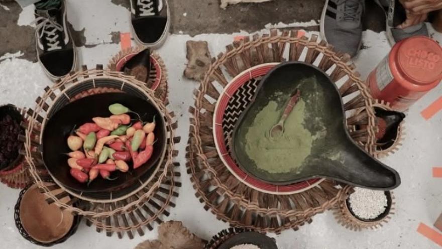 Variety of chocolate products and preparations displayed on a table decorated with flowers.